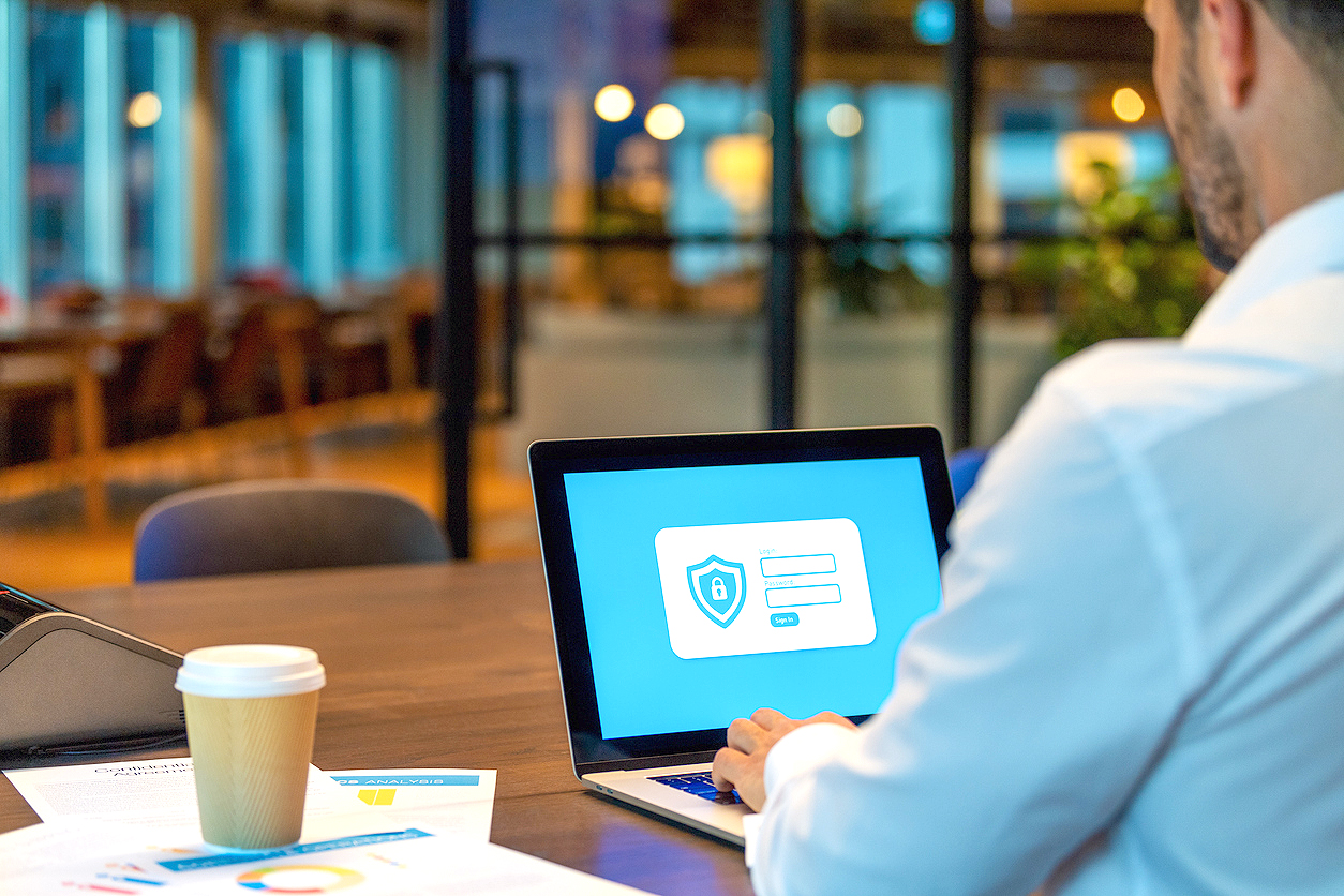 An image of a man on a laptop