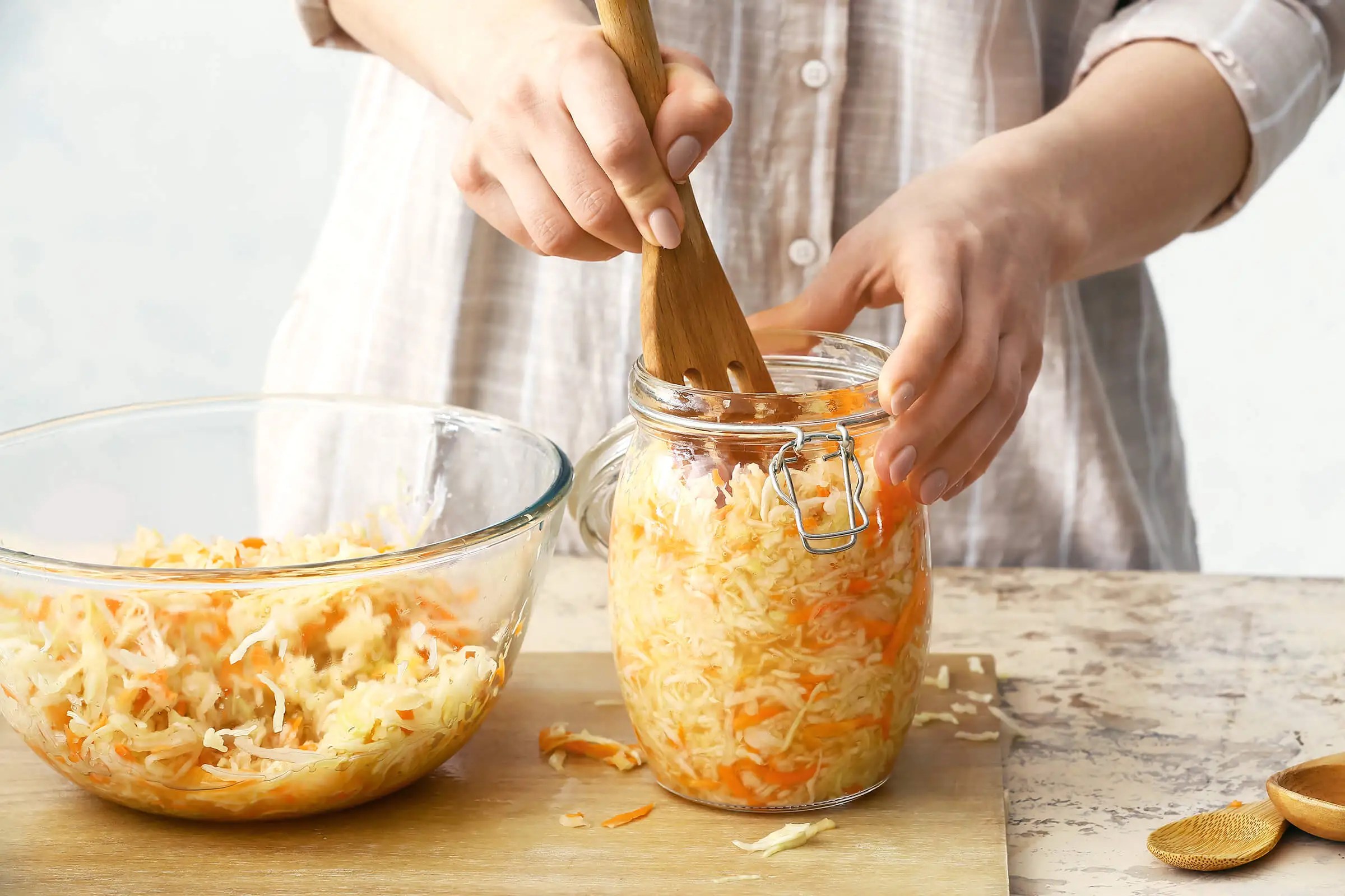 Putting food in a jar
