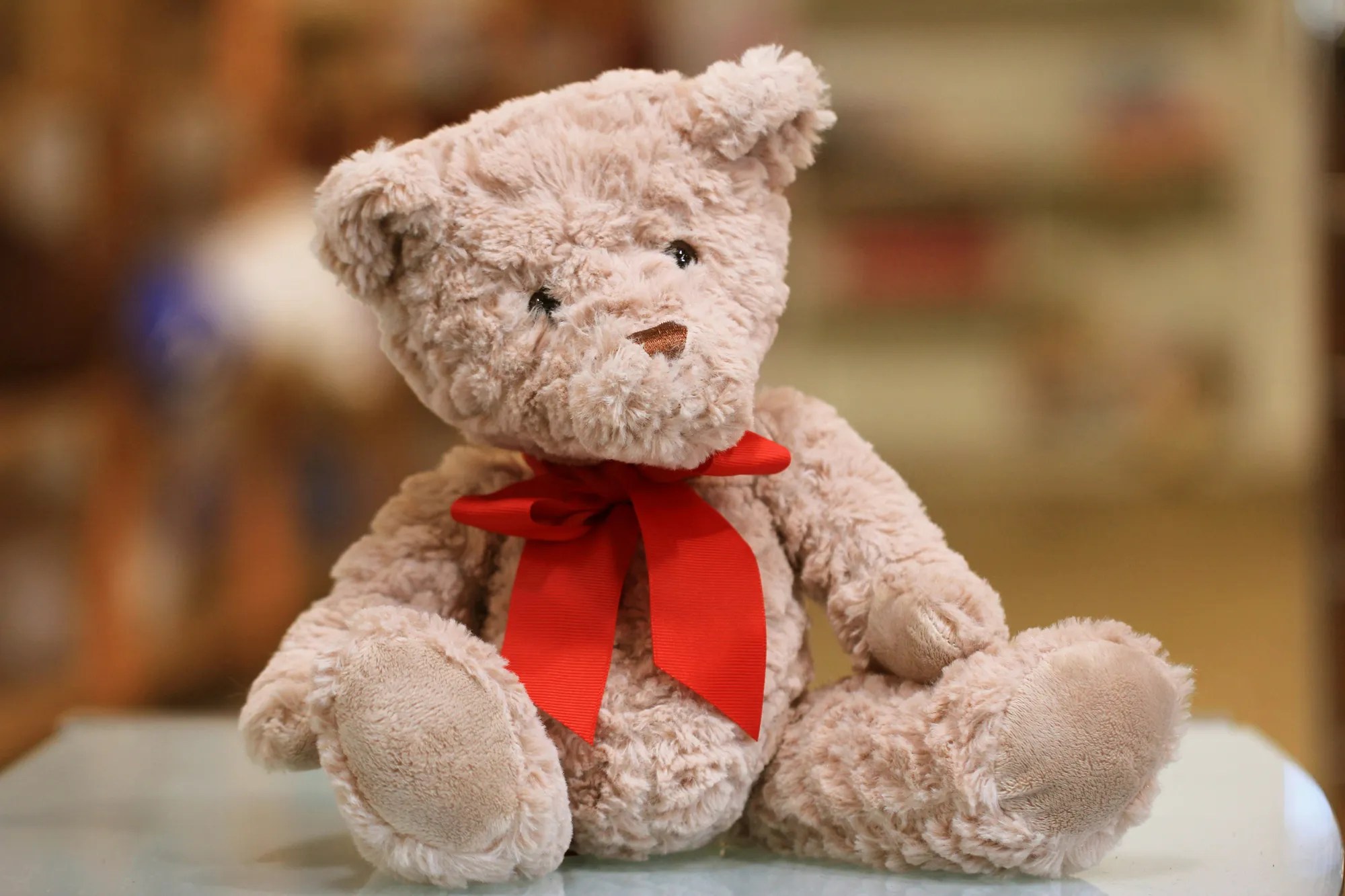 A teddy bear with a red bow
