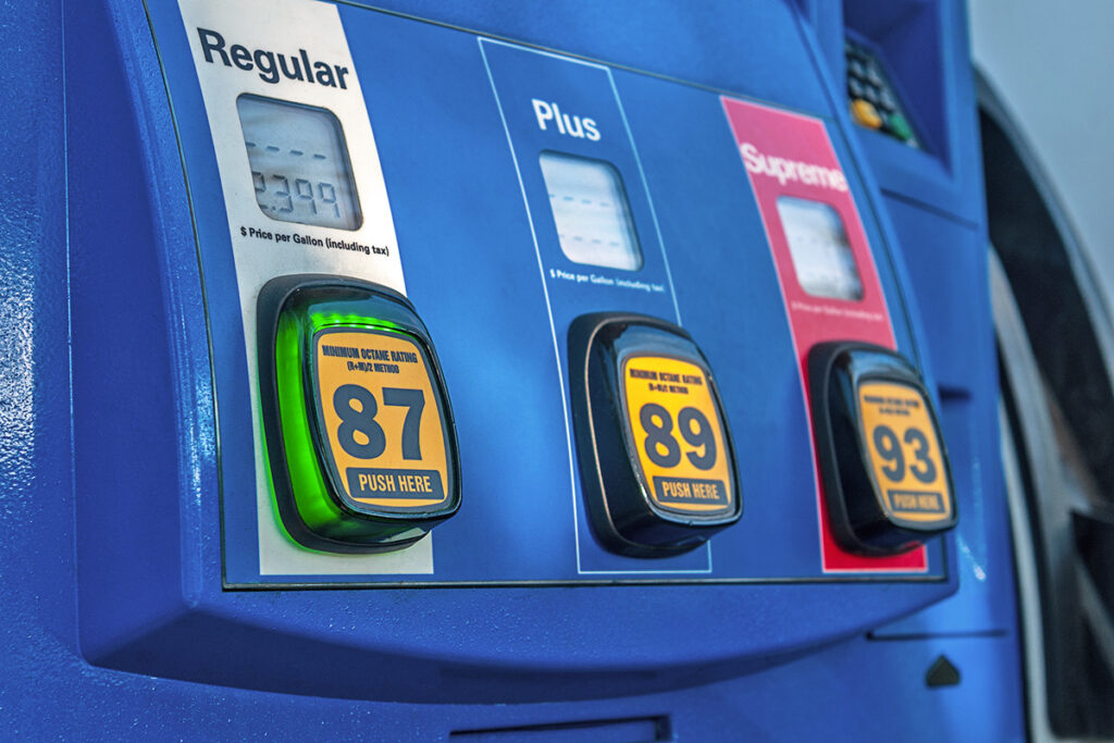 A gas pump with three types of gas: regular, plus, and premium