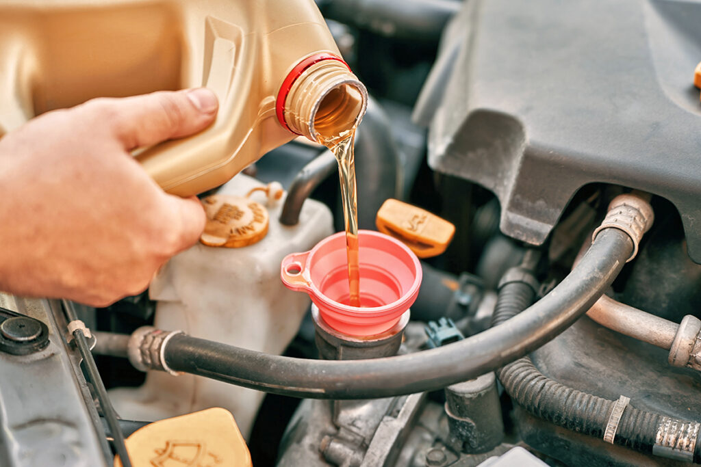Pouring oil into an engine