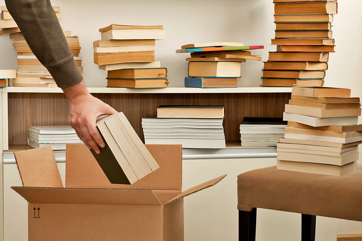 Person putting books in a box