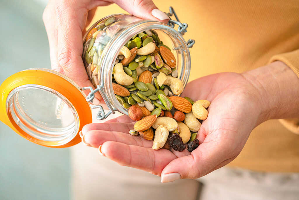 Person holding jar of nuts