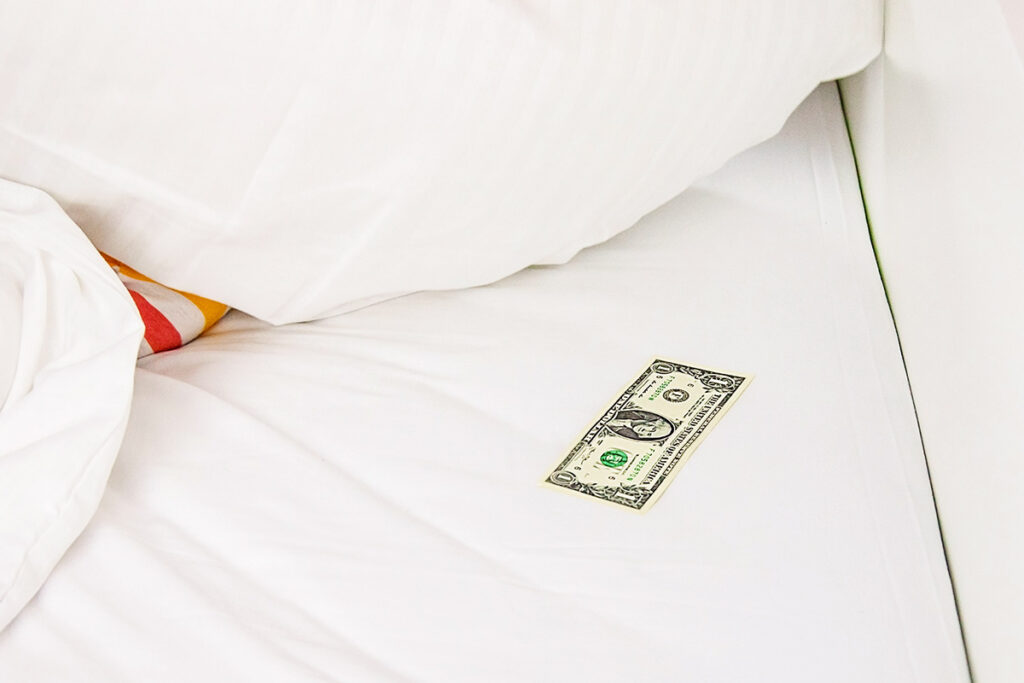 Dollar bill on a bed