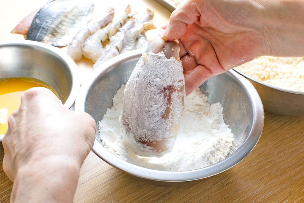 Dredging fish in flour