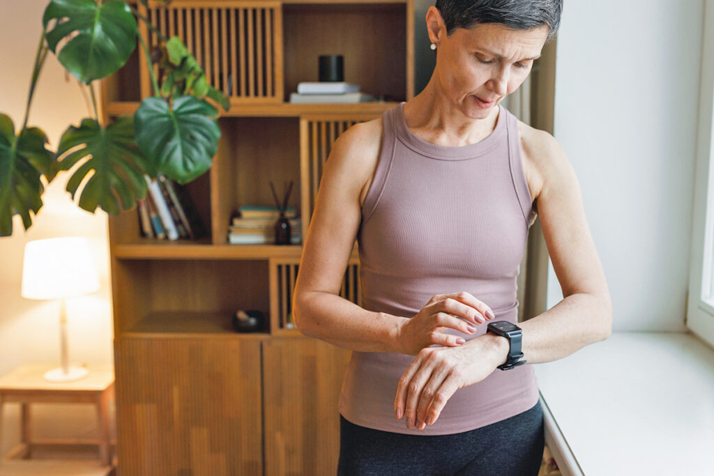 Woman checking smartwatch
