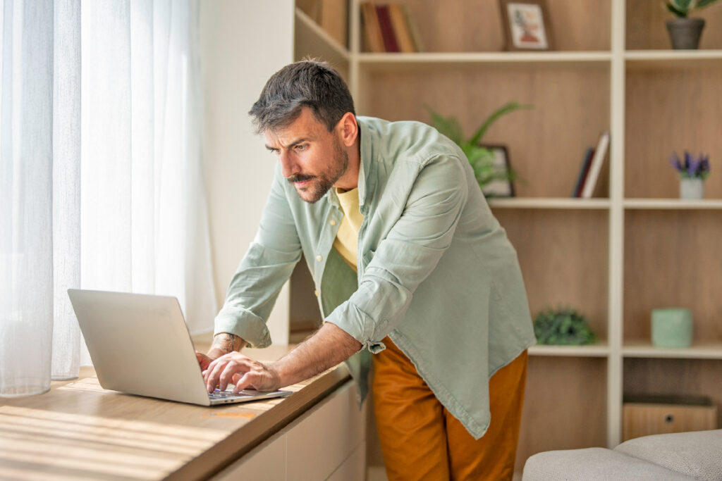 Man typing on computer