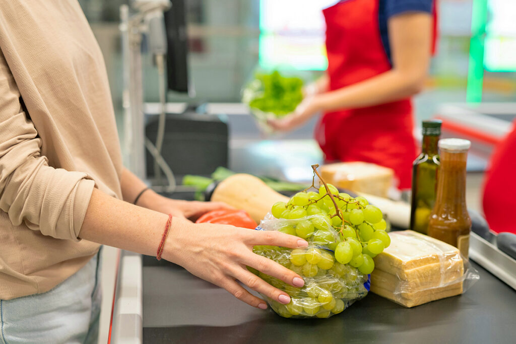 Person checking out at grocery store