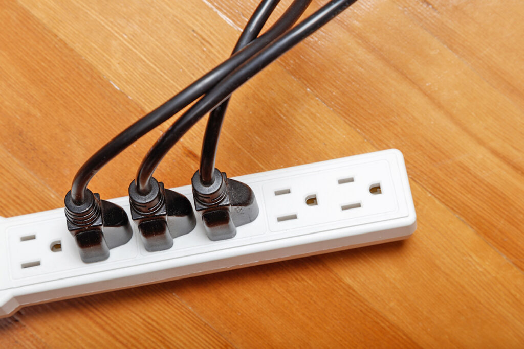 Power strip with items plugged in