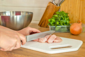 Cutting raw chicken