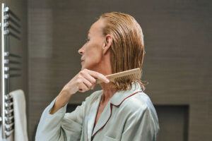 Woman brushing wet hair