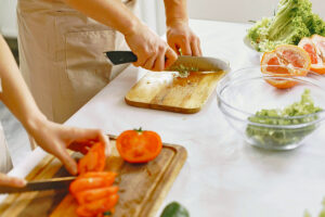 People chopping vegetables