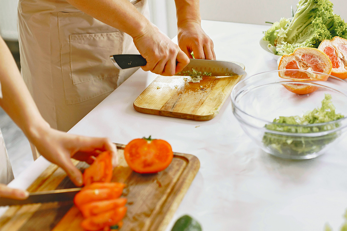People chopping vegetables