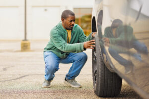 Man checking tire