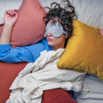 Woman sleeping with face mask