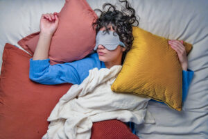 Woman sleeping with face mask