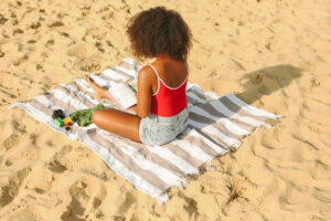 Woman reading at beach
