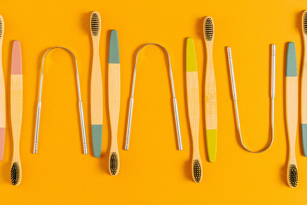 Tongue scrapers and toothbrushes