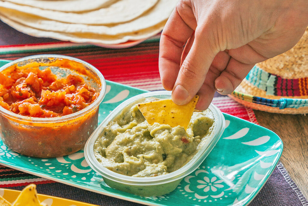 Dipping a chip in guacamole