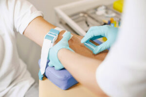 Doctor drawing blood