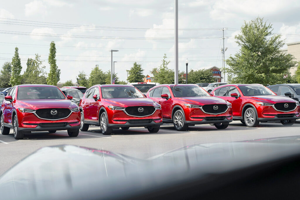 Cars in a car dealership parking lot