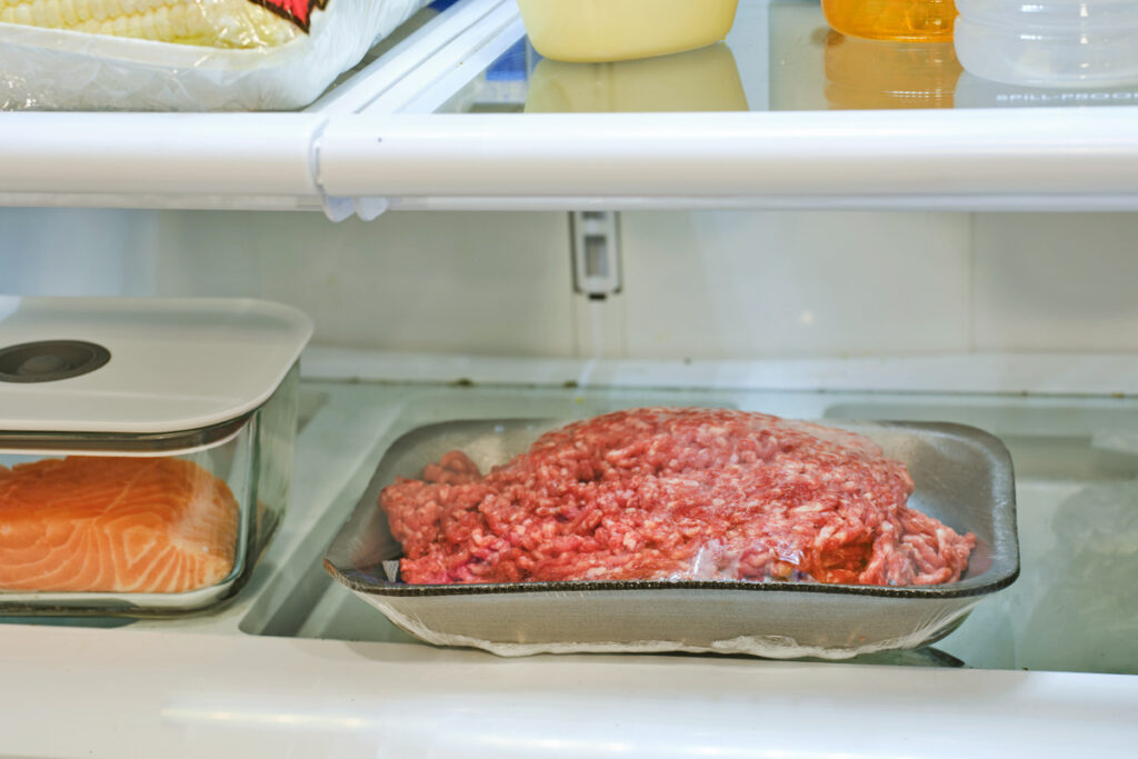 Ground meat on a plate in the fridge