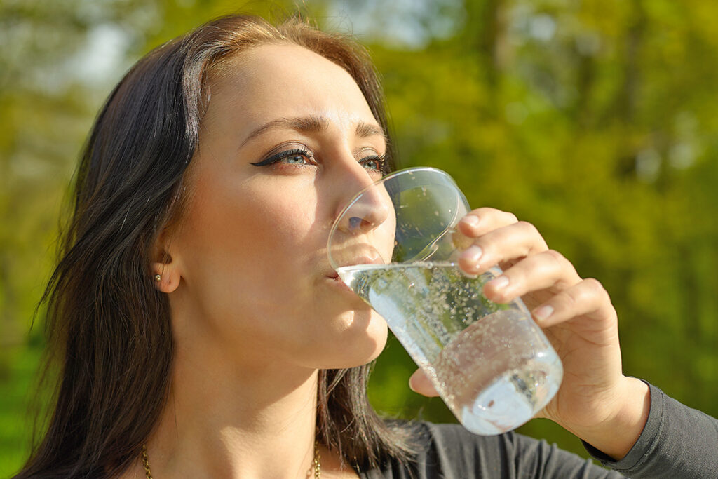 Woman drinking sparkling water
